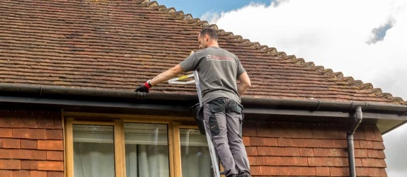 our team cleaning the gutters on a house in Stoke Bishop, Hertfordshire